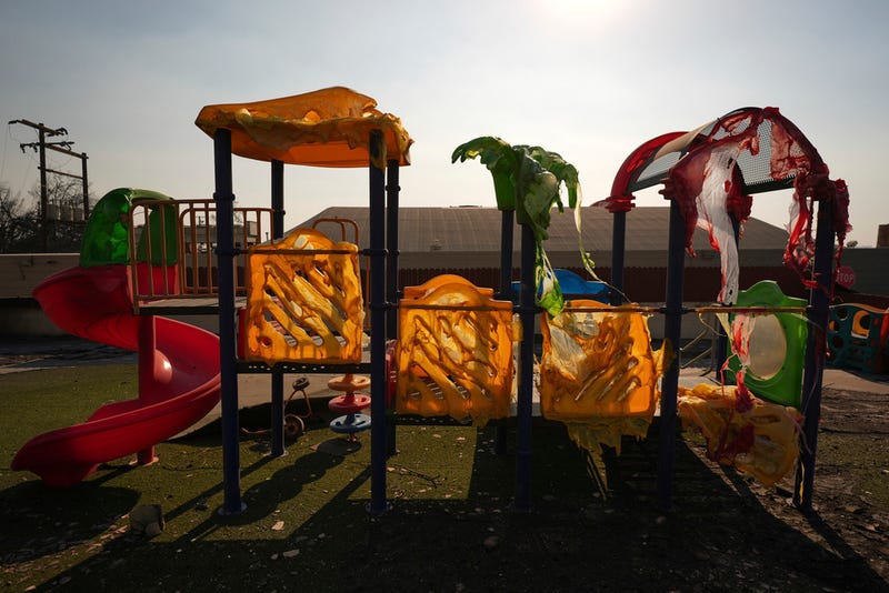 A playground melted and destroyed by the Eaton Fire sits Friday, Jan. 10, 2025, in Altadena, Calif. (AP Photo/Jae C. Hong)