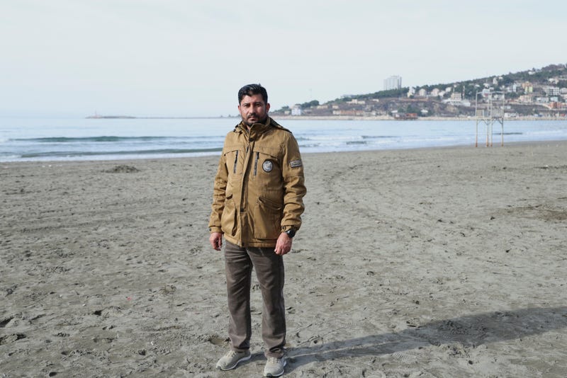 Afghan Hashmatullah Alam, 40, who worked with U.S. Army, poses at a beach in Shengjin, northwestern Albania, Monday, Jan. 27, 2025.