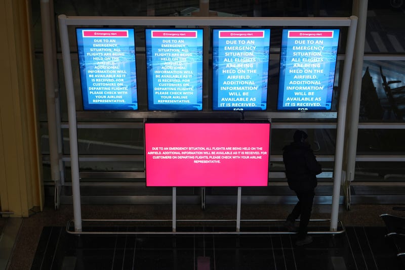 An information board displays a message at Ronald Reagan Washington National Airport, Jan. 29, 2025, in Arlington, Va.