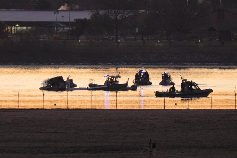 Search and rescue efforts are seen around a wreckage site in the Potomac River from Ronald Reagan Washington National Airport, early Thursday morning, Jan. 30, 2025, in Arlington, Va.