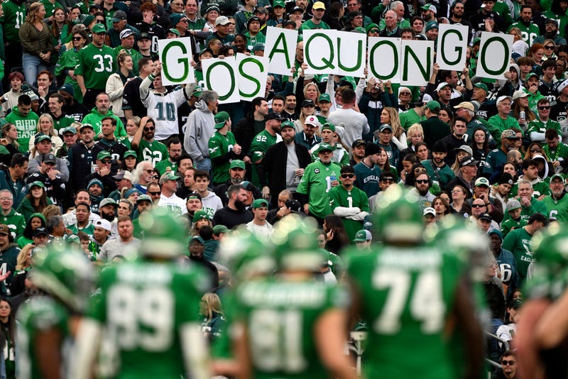 Philadelphia Eagles fans hold a sign that reads "Go Saquon Go" during the second half of an NFL football game against the Dallas Cowboys, Sunday, Dec. 29, 2024, in Philadelphia.
