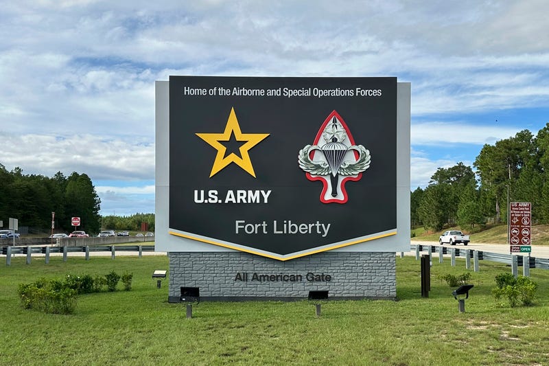 Vehicles pass a sign for Fort Liberty, an Army installation near Fayetteville, N.C., on Tuesday, Oct. 1, 2024