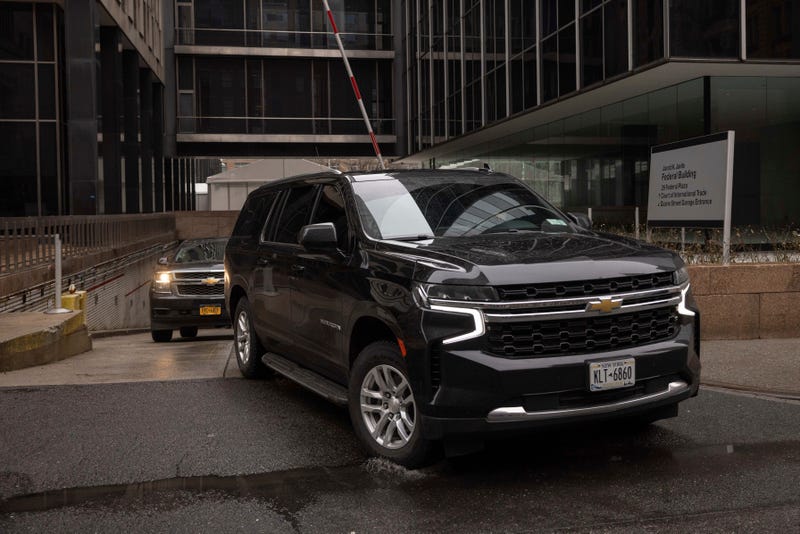 A car carrying Border Czar Tom Homan drives out of the Federal Plaza, Thursday, Feb. 13, 2025, in New York