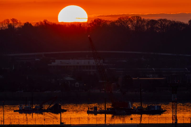 Salvage crews work near the wreckage site in the Potomac River of a mid-air collision between an American Airlines jet and a Black Hawk helicopter, at Ronald Reagan Washington National Airport, Feb. 4, 2025, in Arlington, Va. 