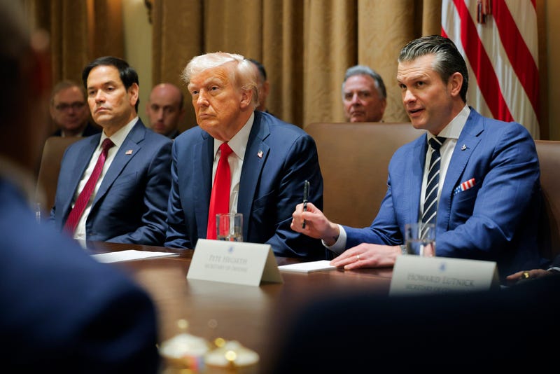 President Donald Trump listens during a Cabinet meeting at the White House in Washington, Tuesday, Feb. 26, 2025, as Secretary of State Marco Rubio and Defense Secretary Pete Hegseth listen.