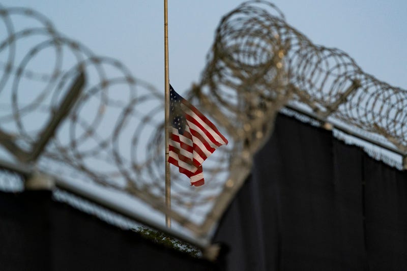 FILE - In this Aug. 29, 2021, file photo reviewed by U.S. military officials, a flag flies at half-staff as seen from Camp Justice in Guantanamo Bay Naval Base, Cuba.