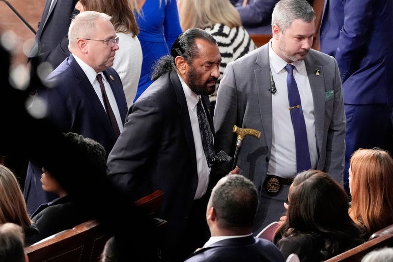 Rep. Al Green, D-Texas, center, is escorted out as President Donald Trump addresses a joint session of Congress at the Capitol in Washington, Tuesday, March 4, 2025.