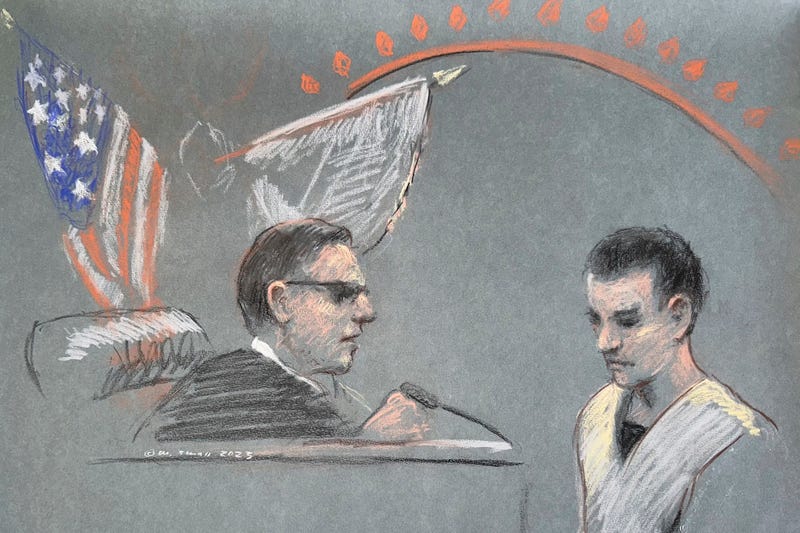 FILE - Massachusetts Air National Guardsman Jack Teixeira, right, appears in U.S. District Court in Boston, Friday, April 14, 2023.