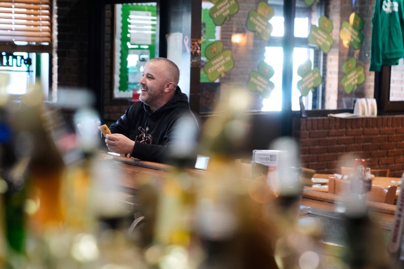 Terence Haggerty grabs a quick lunch at his family bar, Jody's Club Forest, in Staten Island, New York, Monday, March 10, 2025.