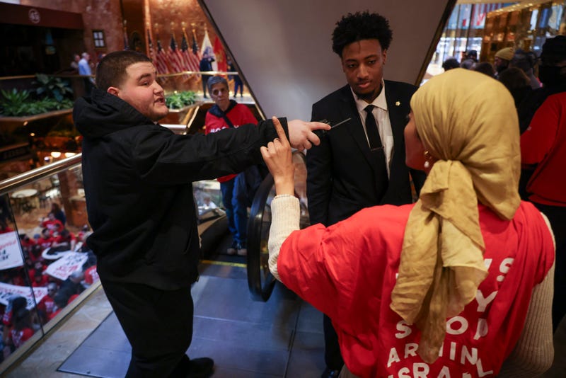 Security personnel with Trump Tower confront a demonstrator from the group, Jewish Voice for Peace, as they protest inside Trump Tower in support of Columbia graduate student Mahmoud Khalil, Thursday, March 13, 2025, in New York