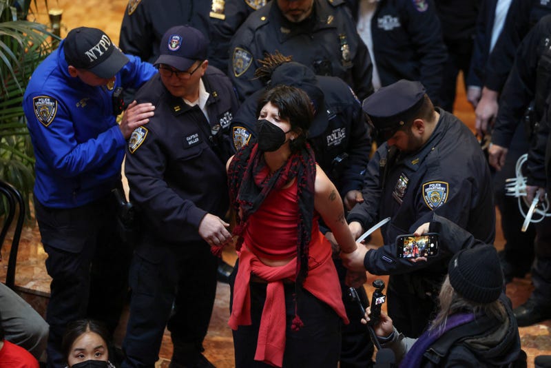 NYPD officers arrest a demonstrator from the group, Jewish Voice for Peace, who protested inside Trump Tower in support of Columbia graduate student Mahmoud Khalil, Thursday, March 13, 2025, in New York