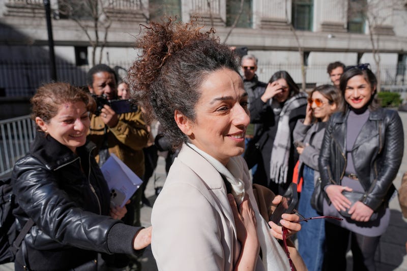 Masih Alinejad greets friends and supporters outside the federal courthouse after testifying at the trial of two men accused of allegedly plotting to kill her in New York, Tuesday, March 18, 2025. 