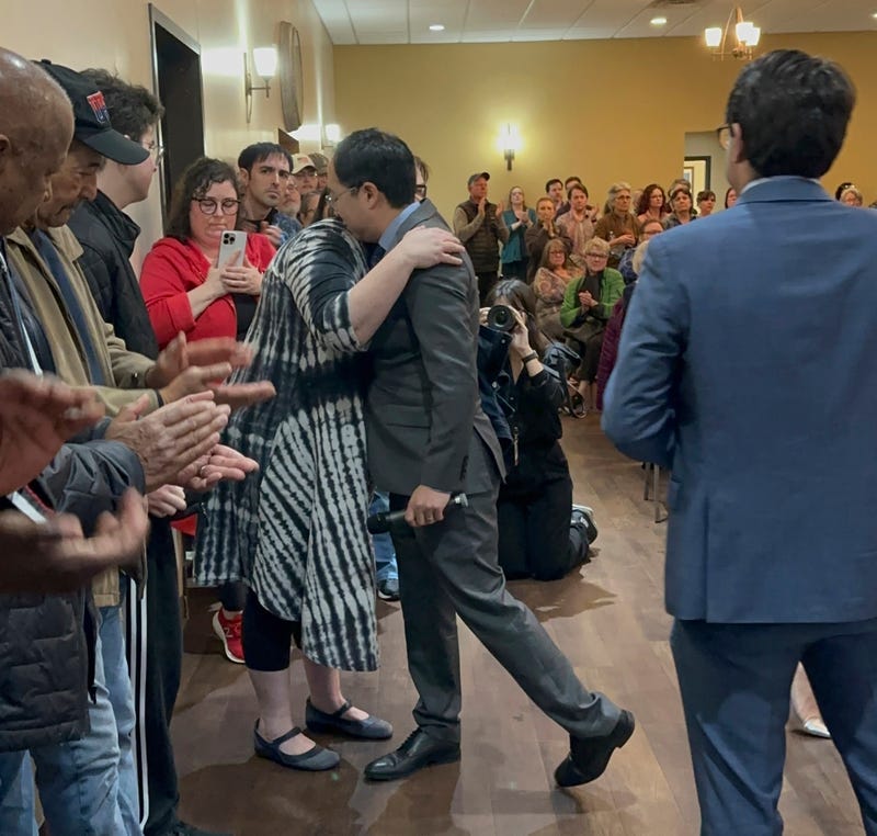 New Jersey Democratic Sen. Andy Kim hugs a woman who said she's worried about Medicaid being cut and the effect it would have on her 24-year-old son with Down Syndrome, during a town hall held in a Republican congressional district, Egg Harbor City, N.J., Thursday, March 20, 2025.