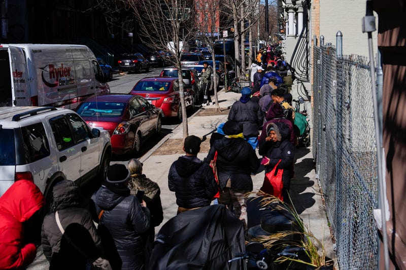 People wait in line to receive free eggs from FarmerJawn Agriculture, Friday, March 21, 2025, in the Harlem neighborhood of New York.