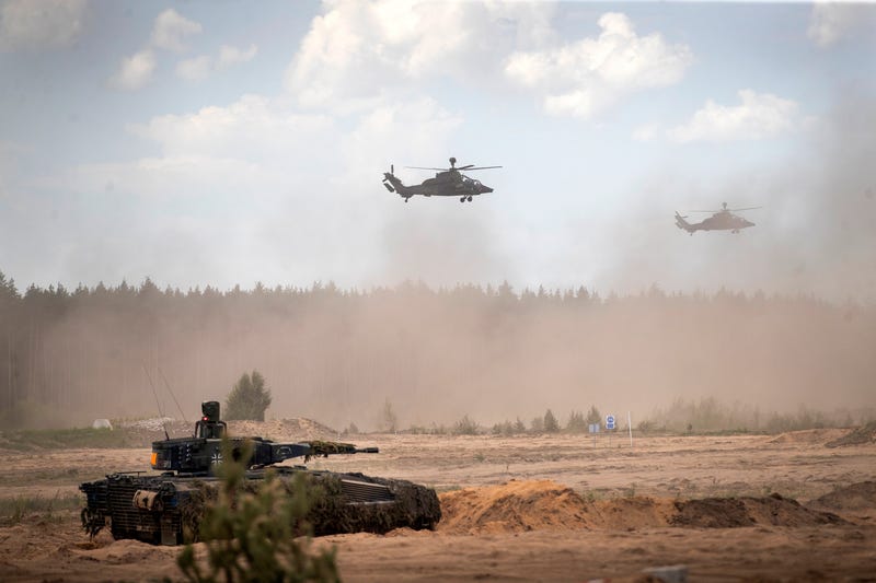 FILE - Eurocopters Tiger of the German Army take part in the Lithuanian-German division-level international military exercise 'Grand Quadriga 2024' at a training range in Pabrade, north of the capital Vilnius, Lithuania on May 29, 2024