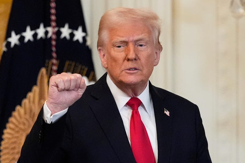 President Donald Trump gestures after speaking at a reception celebrating Women's History Month in the East Room of the White House, Wednesday, March 26, 2025, in Washington.