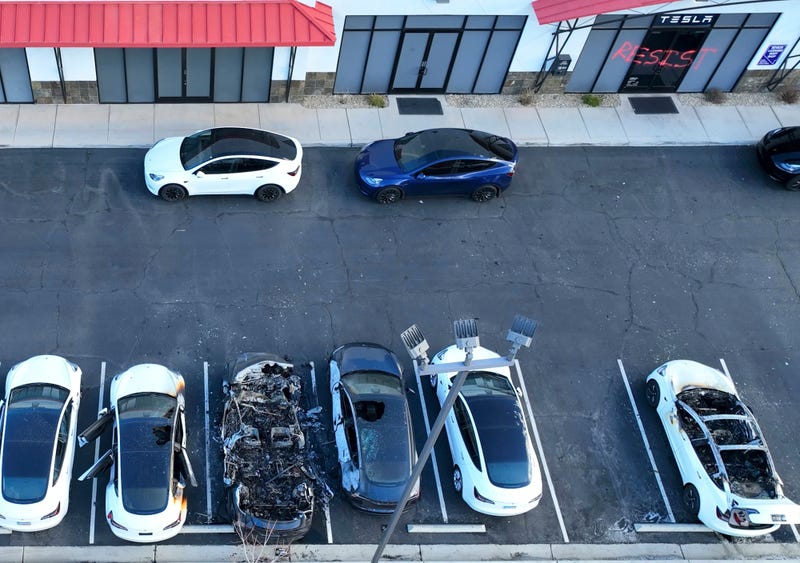 FILE - Police are investigating after several vehicles were set on fire at a Tesla service center, Tuesday, March 18, 2025, in Las Vegas