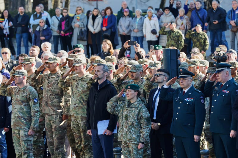 U.S. Army soldiers and Lithuanian servicemen salute as they attend a solemn farewell ceremony at Cathedral Square in Vilnius, Lithuania, Thursday, April 3, 2025 for the US soldiers who died during training exercise.