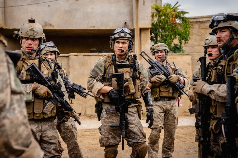 This image released by A24 shows Charles Melton, center, in a scene from "Warfare."
