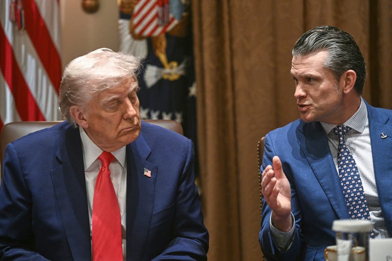 President Donald Trump listens as Defense Secretary Pete Hegseth speaks at a cabinet meeting in the Cabinet Room of the White House, Thursday, April 10, 2025, in Washington