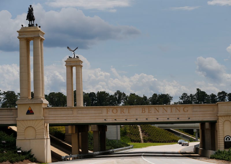 FILE - A bridge over I 185 marks the entrance to the U.S. Army's Fort Benning in Columbus, Ga., Aug. 21, 2015.