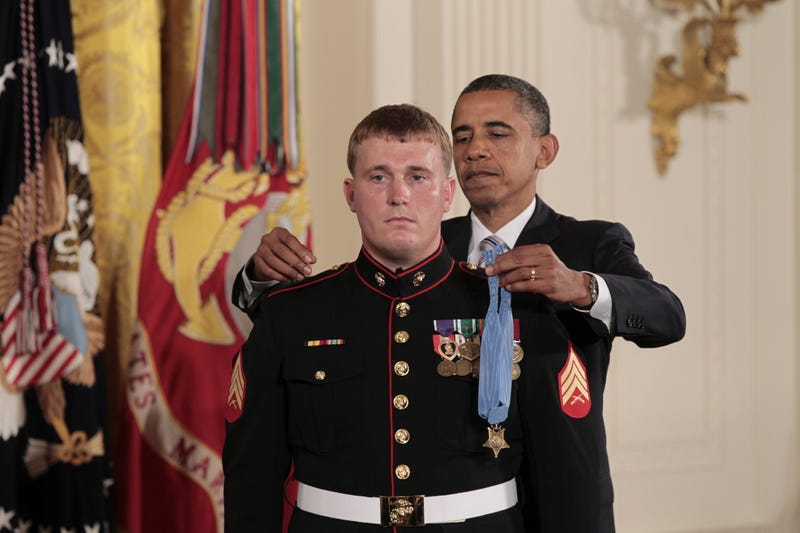 FILE - President Barack Obama awards the Medal of Honor to Marine Corps Cpl. Dakota Meyer, 23, from Greensburg, Ky, in a ceremony in the East Room of the White House in Washington, Sept., 15, 2011.
