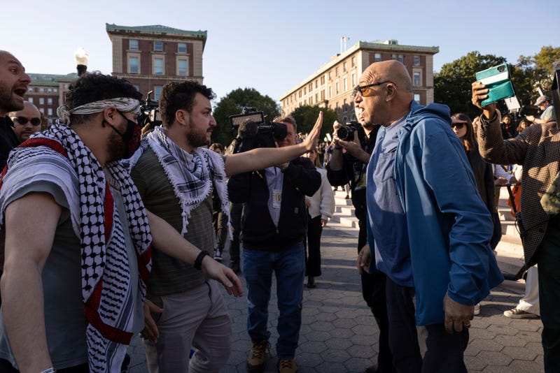 Pro-Palestinian demonstrator Mahmoud Khalil, second from left, debates with a pro-Israel demonstrator during a protest at Columbia University, Thursday, Oct. 12, 2023, in New York.