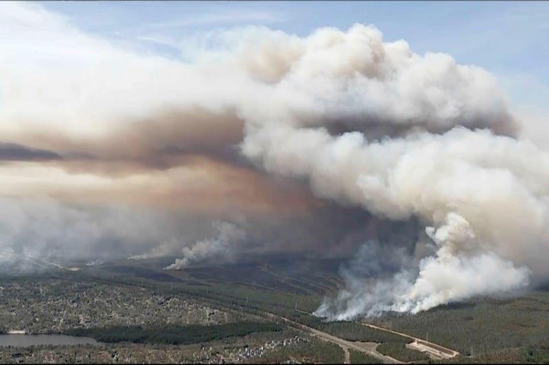 In this image taken from aerial video shows smoke rising from wildfires in Ocean County, N.J., Wednesday, April 23, 2025.
