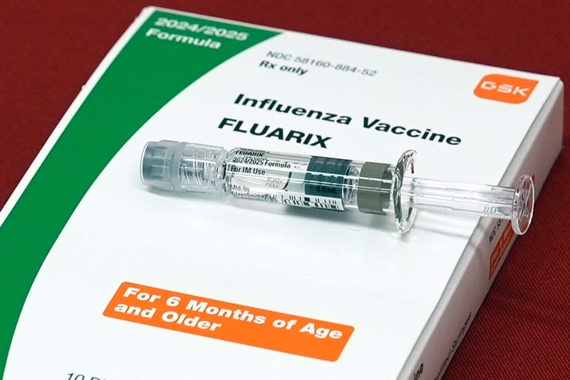 A flu vaccine is displayed at a pharmacy. The CDC reports the flu vaccination rate for U.S. children has plummeted from about 64% five years ago to 49% this season