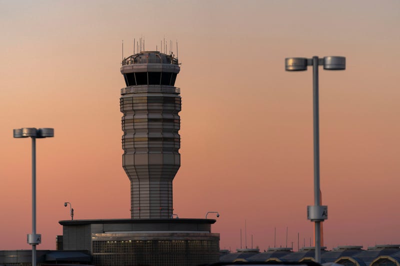 FILE - The air traffic control tower at Ronald Reagan Washington National Airport is seen at sunset, Feb. 1, 2025, in Arlington, Va.
