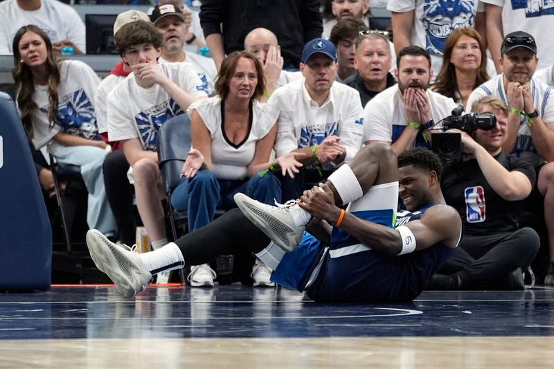 Minnesota Timberwolves guard Anthony Edwards (5) grabs his leg during the first half of Game 2 of an NBA basketball second-round playoff series against the Golden State Warriors, Thursday, May 8, 2025, in Minneapolis. 