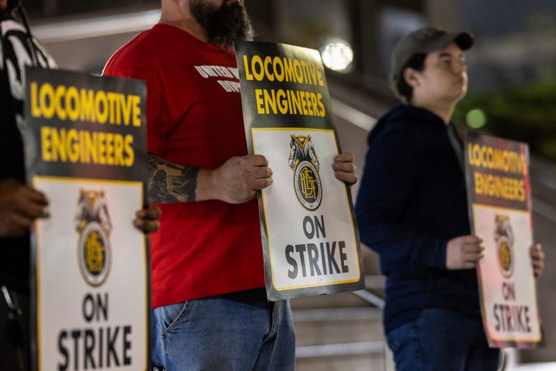 Union members from the Brotherhood of Locomotive Engineers and Trainmen form a picket line outside the NJ Transit Headquarters on May 16, 2025, in Newark, New Jersey.