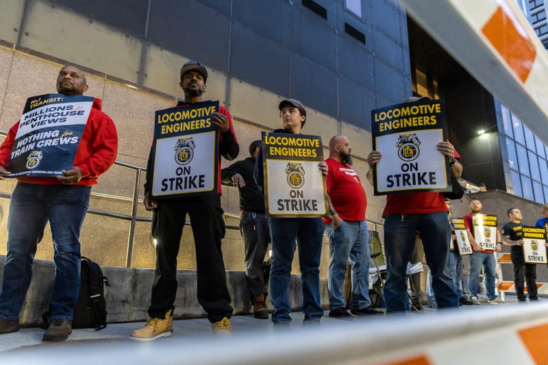 Union members from the Brotherhood of Locomotive Engineers and Trainmen form a picket line outside the NJ Transit Headquarters on May 16, 2025, in Newark, New Jersey.
