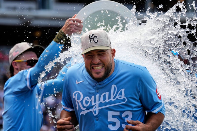 Kansas City Royals relief pitcher Carlos Estevez is doused by teammates after their baseball game against the St. Louis Cardinals, Sunday, May 18, 2025, in Kansas City, Mo.