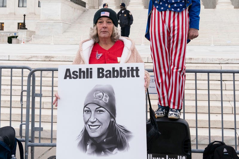 FILE - Micki Witthoeft, center, mother of Ashli Babbitt, the woman fatally shot by police inside the U.S. Capitol during the Jan. 6, 2021, riot, joins protesters outside of the Supreme Court on the second anniversary of the Jan. 6, assault on the U.S. Capitol, in Washington, Jan. 6, 2023.