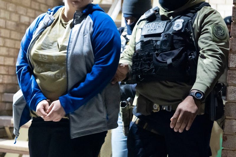 U.S. Immigration and Customs Enforcement officers detain a person in Silver Spring, Md., Jan. 27, 2025.