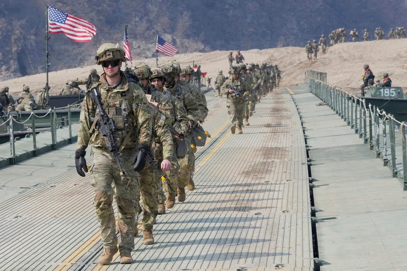 FILE - U.S. Army soldiers cross a floating bridge on the Imjin River during a joint river-crossing exercise between South Korea and the United States as a part of the Freedom Shield military exercise in Yeoncheon, South Korea, March 20, 2025.