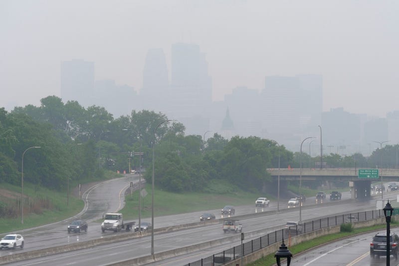 The smell of smoke hung over the Minneapolis-St. Paul area on Tuesday morning despite rain that obscured the full measure of the dirty air.