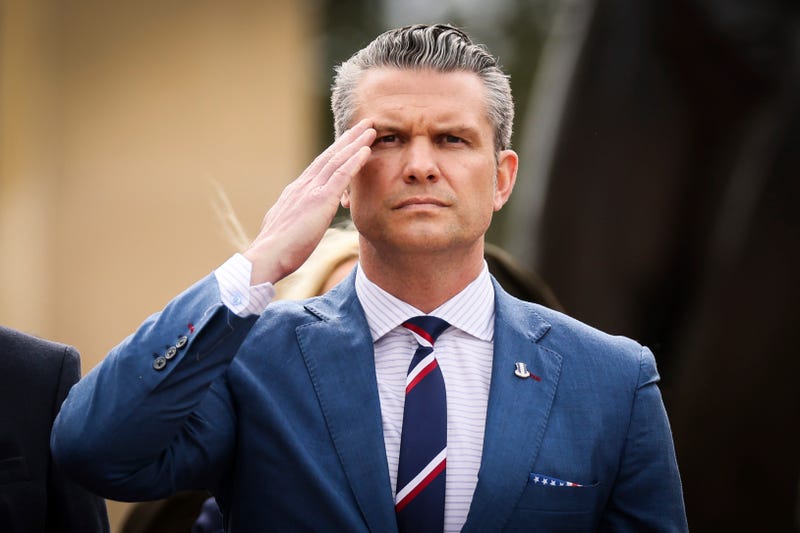 Defense Secretary Pete Hegseth salutes during a ceremony at the US cemetery to commemorate the 81st anniversary of the D-Day landings, Friday, June 6, 2025 in Colleville-sur-Mer, Normandy.