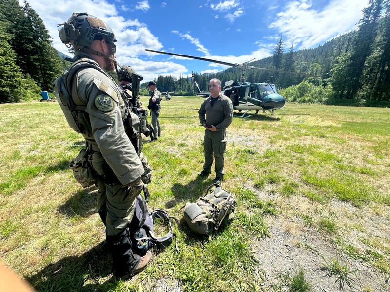 In this handout photo provided by the Snohomish County Sheriff's Office deputies participate in the search for Travis Decker, at an undisclosed location in Washington state, Friday, June 6, 2025.