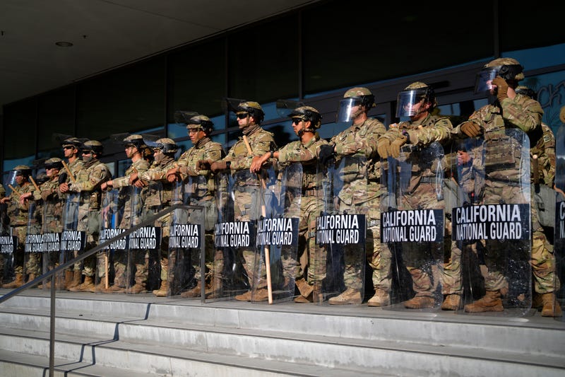 California National Guard stand in formation guarding the federal building in downtown Los Angeles on Tuesday, June 10, 2025.