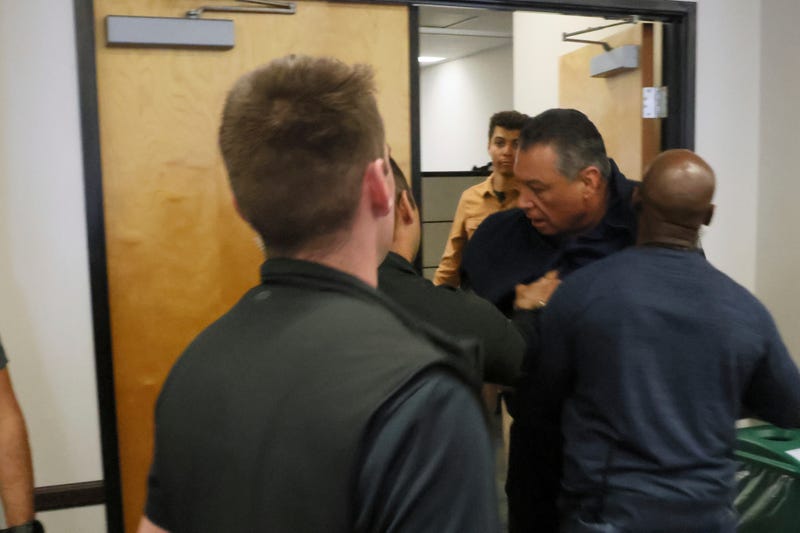 alex padilla being pushed out of room