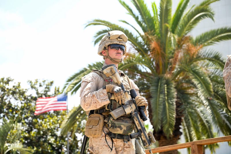 A U.S Marine guards a federal building, Friday, June 13, 2025, in Los Angeles