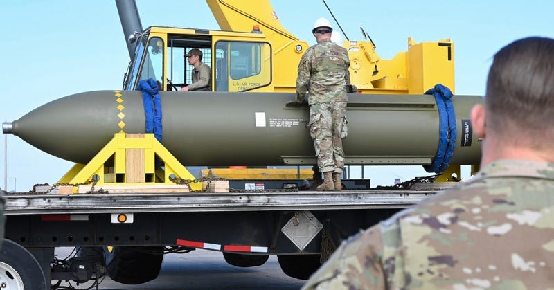 FILE - In this photo released by the U.S. Air Force on May 2, 2023, airmen look at a GBU-57, or the Massive Ordnance Penetrator bomb, at Whiteman Air Base in Missouri