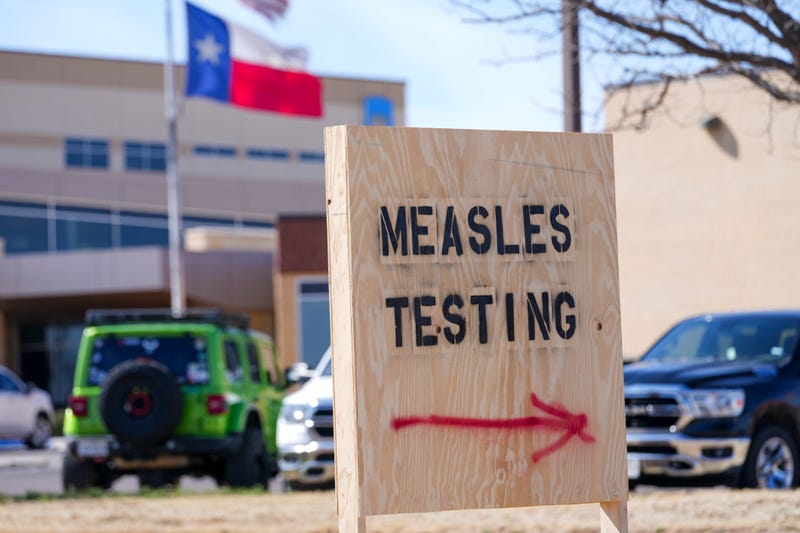 A sign is displayed outside the Seminole Hospital District offering measles testing, Feb. 21, 2025, in Seminole, Texas.