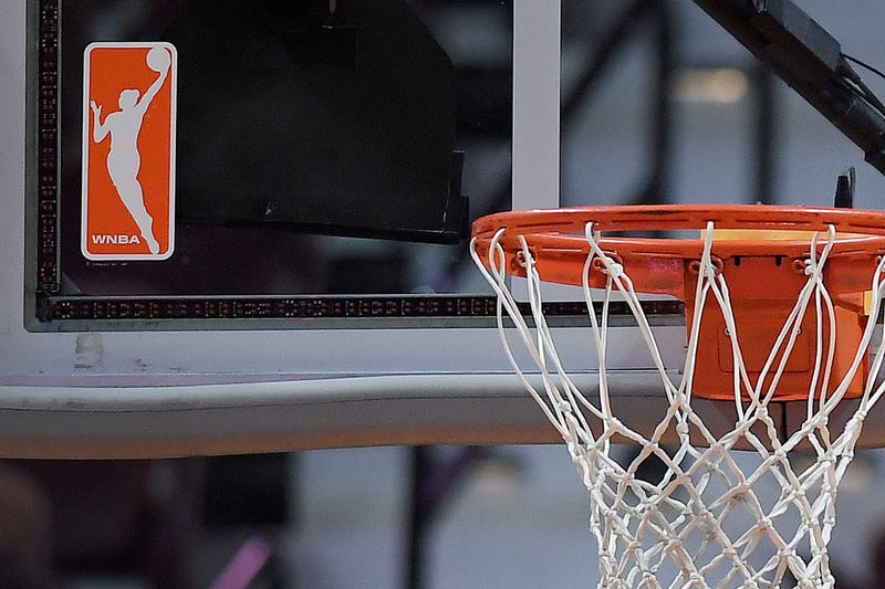 The WNBA logo is seen near a hoop before an WNBA basketball game at Mohegan Sun Arena, Tuesday, May 14, 2019, in Uncasville, Conn.