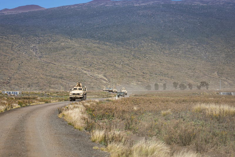 In this photo released by the U.S. Army, soldiers conduct a convoy escort team during Operation PIKO, the 25th Division Sustainment Brigade's annual gunnery Feb. 5, 2025, at Pohakuloa Training Area, Hawaii.