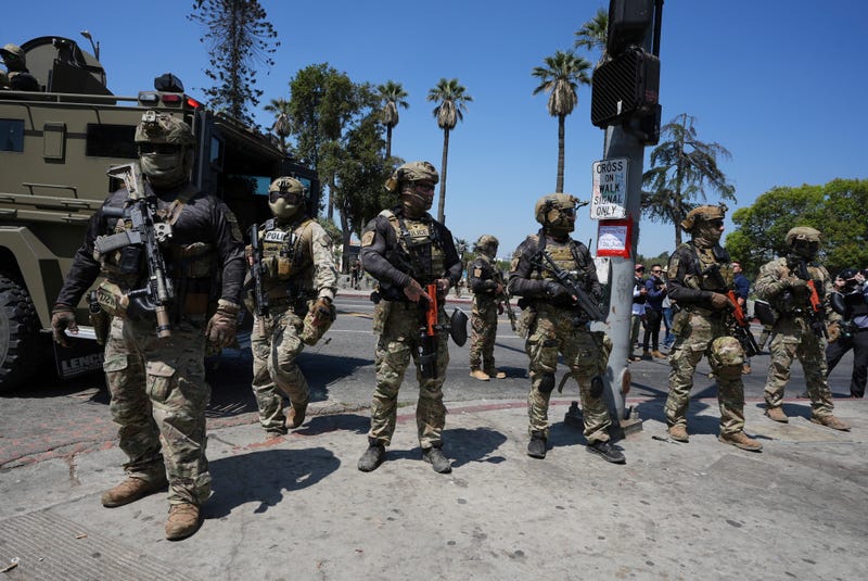 Federal agents stage at MacArthur Park Monday, July 7, 2025, in Los Angeles.