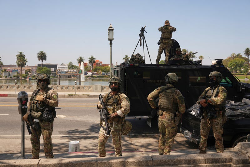 Federal agents stage at MacArthur Park Monday, July 7, 2025, in Los Angeles.