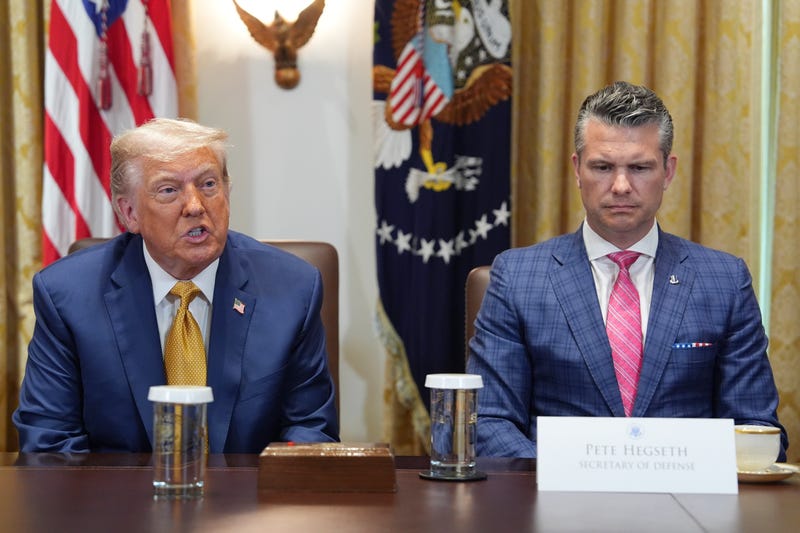 President Donald Trump, left, with Defense Secretary Pete Hegseth, right, during a cabinet meeting at the White House, Tuesday, July 8, 2025, in Washington.